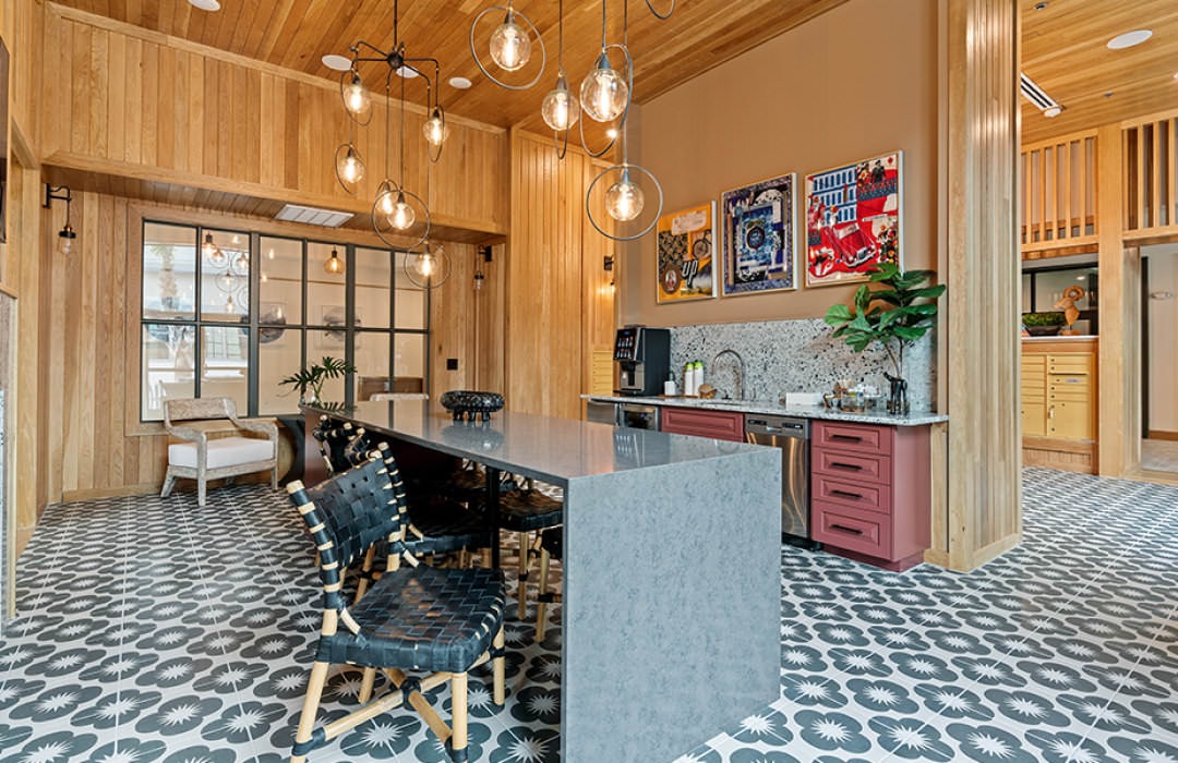 coffee counter and kitchen area in stylishly lit clubhouse